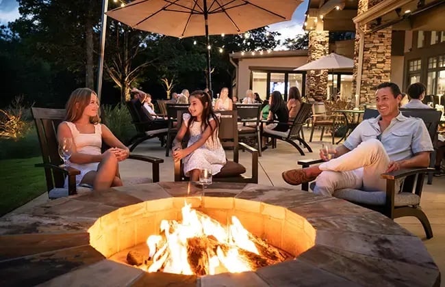 family around firepit at ggcc